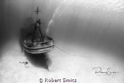 A diver checking out the wreck of the USS Kittiwake. by Robert Smits 